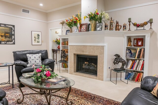 5213 Green Valley Trl, San Angelo, TX 76904 - carpeted living room featuring a tiled fireplace, recessed lighting, and ornamental molding