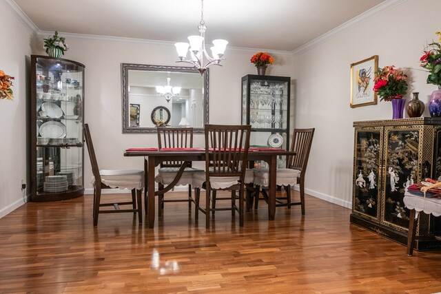 5213 Green Valley Trl, San Angelo, TX 76904 - dining room featuring a chandelier, wood finished floors, and crown molding
