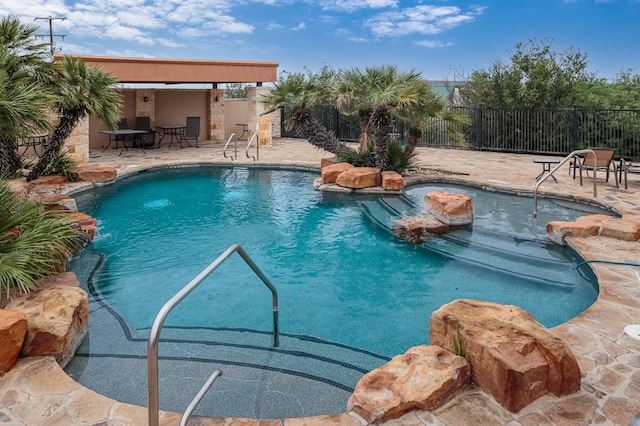 view of pool featuring a patio and pool water feature