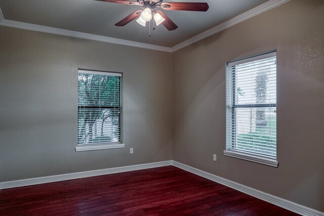 empty room with crown molding, ceiling fan, and hardwood / wood-style flooring