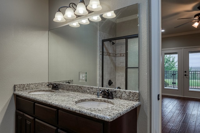 bathroom with ornamental molding, vanity, ceiling fan, walk in shower, and french doors