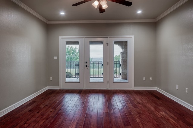 doorway featuring dark wood-type flooring, ceiling fan, ornamental molding, and french doors