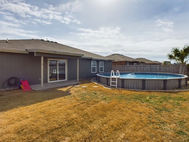 view of yard with a fenced in pool