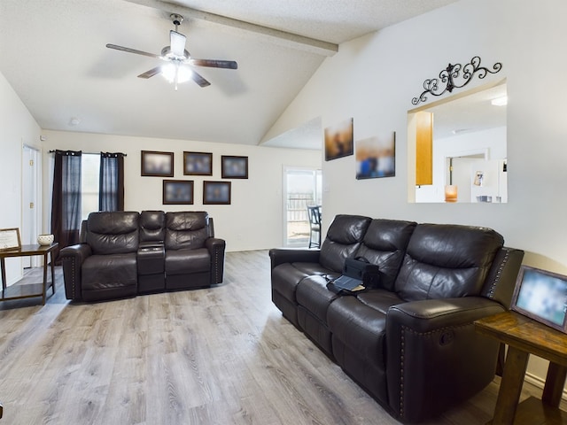 living room featuring ceiling fan, lofted ceiling with beams, and light hardwood / wood-style flooring