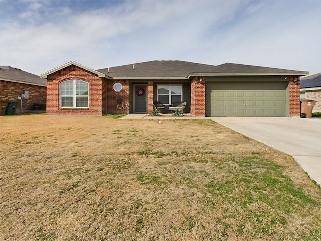 single story home with a garage, cooling unit, and a front lawn