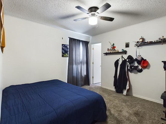 bedroom featuring ceiling fan, carpet flooring, and a textured ceiling