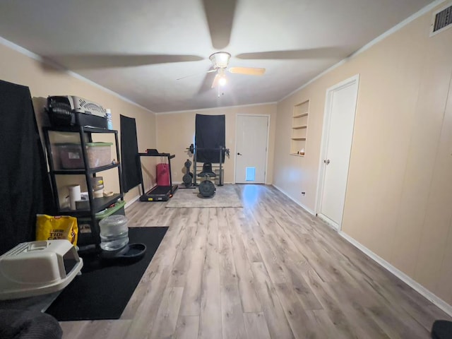 417 E 47th St, San Angelo, TX 76903 - exercise room with wood finished floors, ceiling fan, and ornamental molding