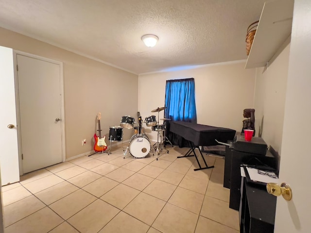 417 E 47th St, San Angelo, TX 76903 - bedroom with a textured ceiling and light tile patterned flooring