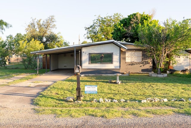 417 E 47th St, San Angelo, TX 76903 - single story home with a front lawn, a carport, and driveway