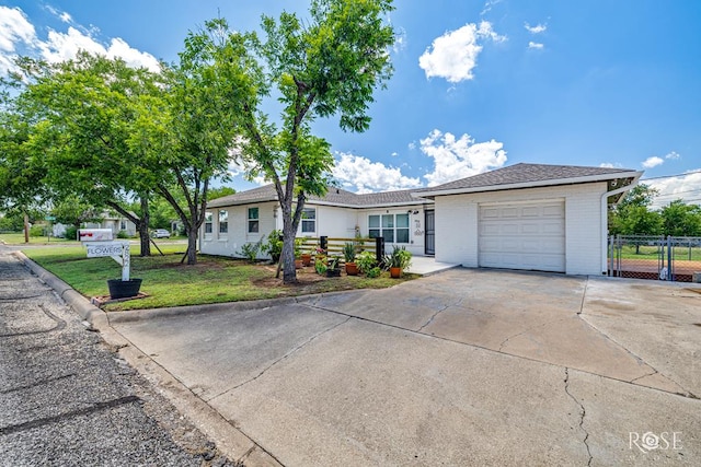 2822 N St, San Angelo, TX 76901 - single story home featuring a garage, driveway, and brick siding
