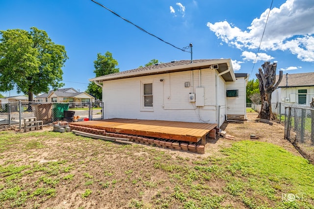 2822 N St, San Angelo, TX 76901 - rear view of property with a fenced backyard and a wooden deck