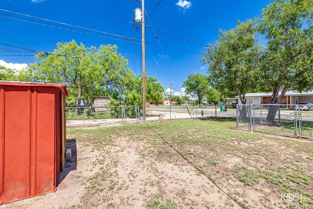 2822 N St, San Angelo, TX 76901 - view of yard with a gate and a storage unit