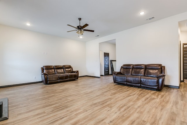 living room with recessed lighting, visible vents, baseboards, a ceiling fan, and light wood-type flooring