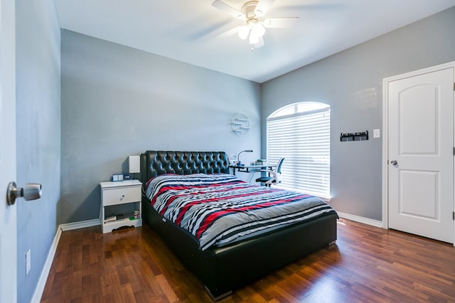 bedroom with baseboards, a ceiling fan, and wood finished floors
