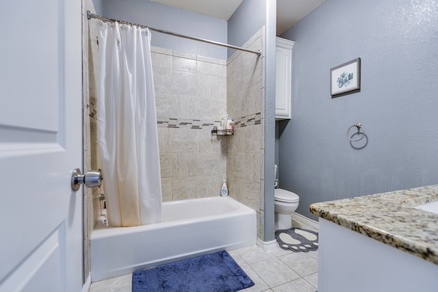 bathroom with shower / bath combo, vanity, toilet, tile patterned floors, and baseboards