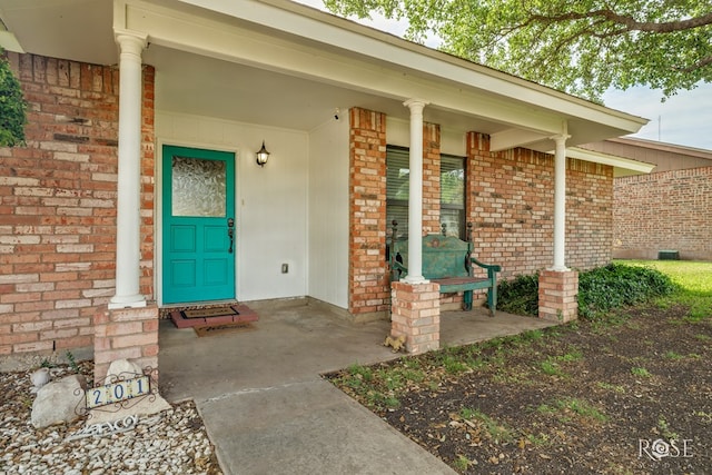 201 Hudspeth St, Sonora, TX 76950 - property entrance featuring brick siding and a porch