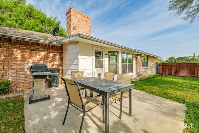 201 Hudspeth St, Sonora, TX 76950 - view of patio / terrace featuring outdoor dining space, grilling area, and fence