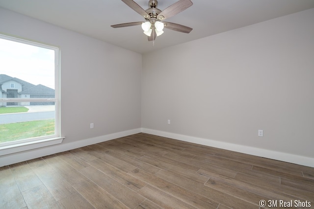 5201 Royal Oak Dr, San Angelo, TX 76904 - spare room with ceiling fan and wood finished floors