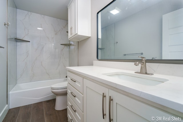5201 Royal Oak Dr, San Angelo, TX 76904 - bathroom featuring wood finished floors, vanity, and tub / shower combination