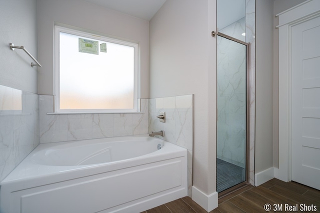 5201 Royal Oak Dr, San Angelo, TX 76904 - bathroom with a garden tub, a marble finish shower, and wood finished floors