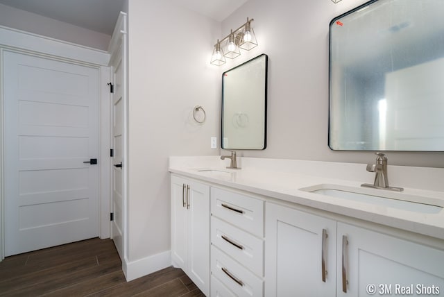 5201 Royal Oak Dr, San Angelo, TX 76904 - bathroom featuring double vanity and wood finished floors