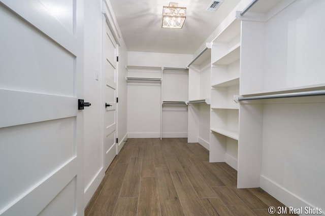 5201 Royal Oak Dr, San Angelo, TX 76904 - spacious closet featuring dark wood-type flooring