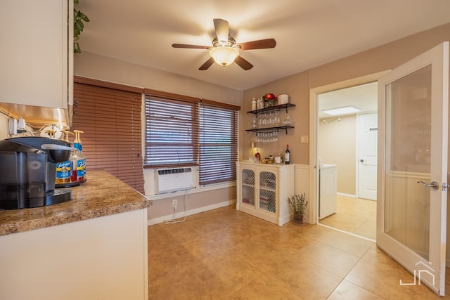 kitchen featuring light countertops, light tile patterned flooring, ceiling fan, and baseboards