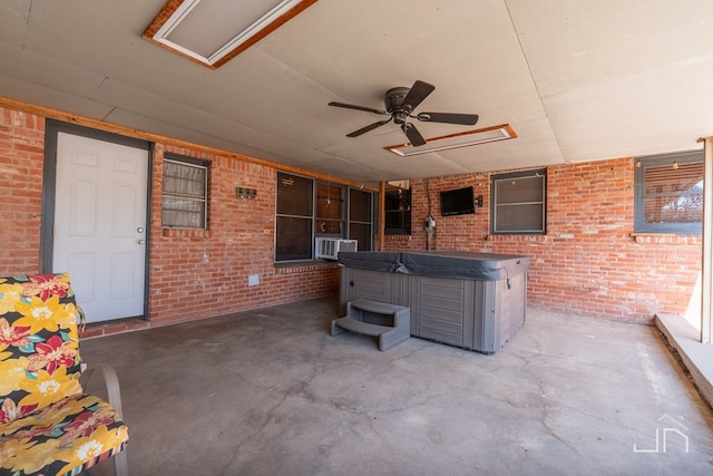 view of patio / terrace with cooling unit, an indoor hot tub, and ceiling fan