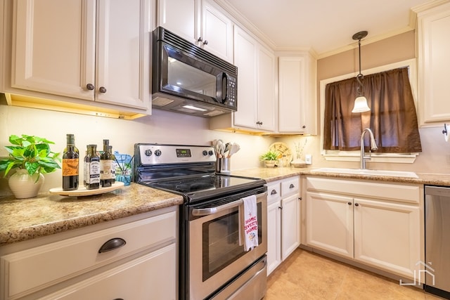 kitchen with light stone counters, appliances with stainless steel finishes, crown molding, pendant lighting, and a sink