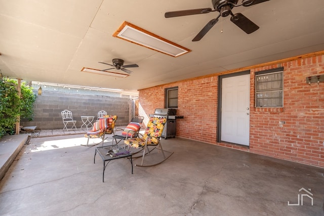 view of patio with a ceiling fan and grilling area