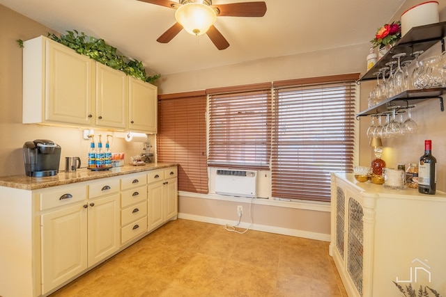 kitchen with light countertops, cooling unit, a healthy amount of sunlight, and a ceiling fan