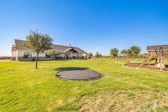 view of yard with a trampoline