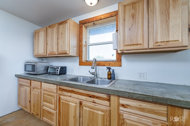 kitchen with sink and light brown cabinets