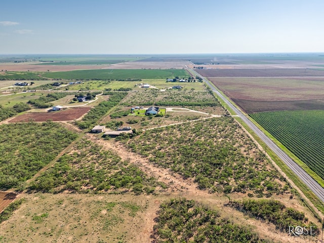 birds eye view of property featuring a rural view