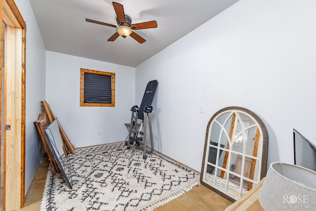 workout room featuring light colored carpet and ceiling fan