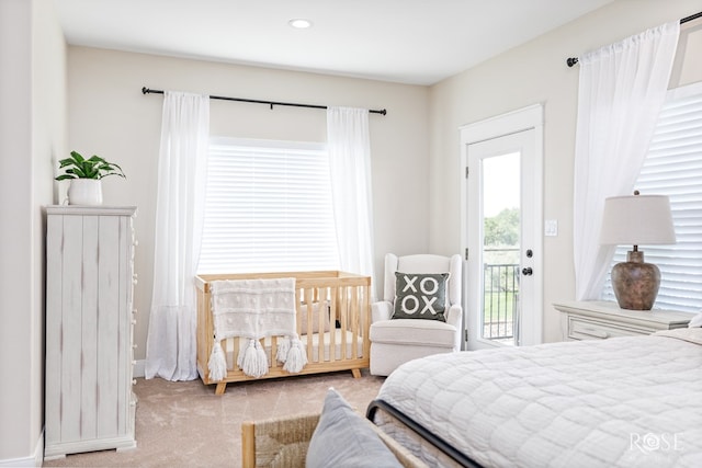 carpeted bedroom featuring access to exterior