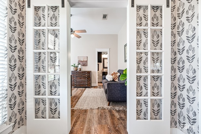 bathroom with hardwood / wood-style flooring and ceiling fan