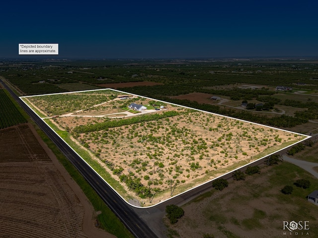 birds eye view of property featuring a rural view