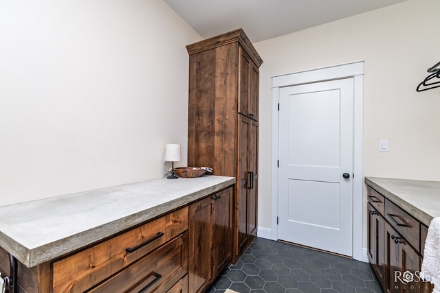 interior space featuring dark tile patterned floors