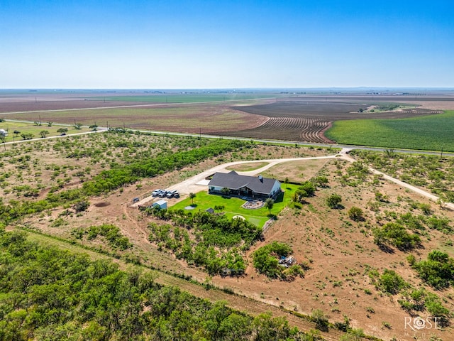 birds eye view of property with a rural view