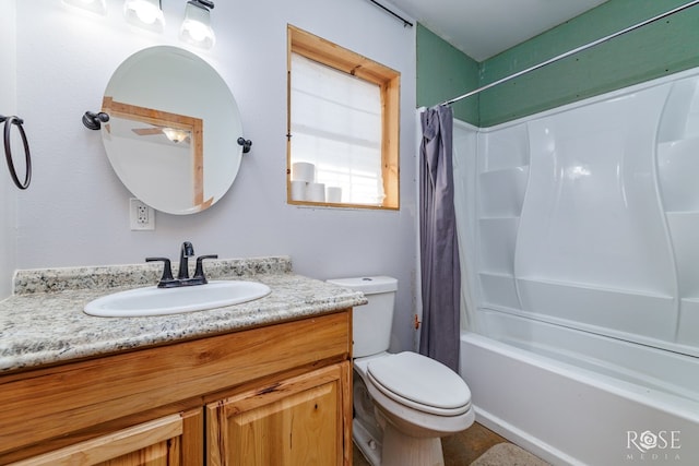 full bathroom featuring shower / bath combination with curtain, vanity, and toilet