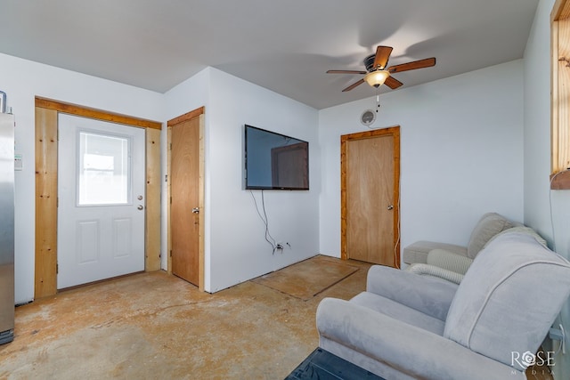 interior space with ceiling fan