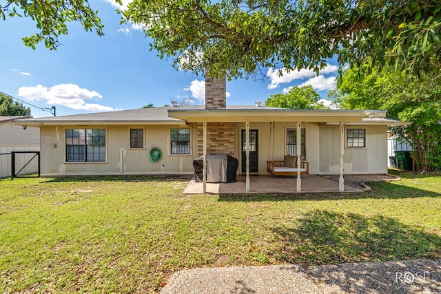 140 Van Zandt St, San Angelo, TX 76905 - back of property with a patio, a chimney, and a gate