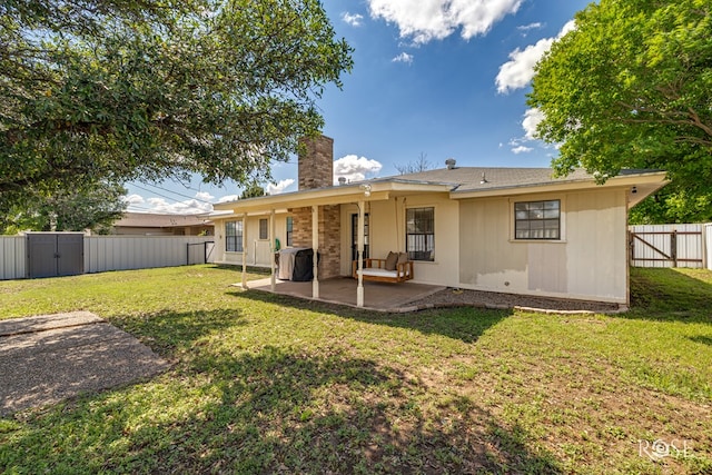 140 Van Zandt St, San Angelo, TX 76905 - back of property featuring a chimney and a patio