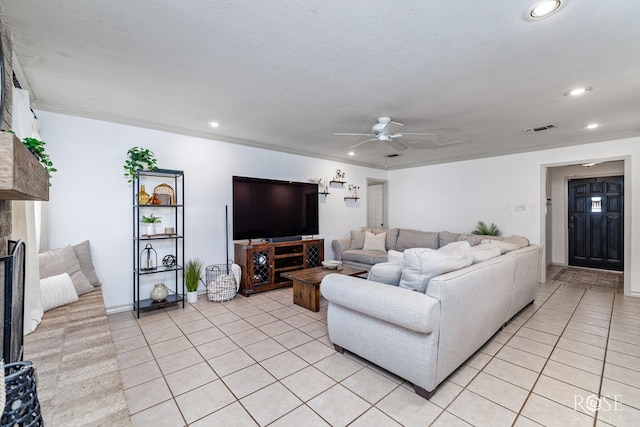 140 Van Zandt St, San Angelo, TX 76905 - living area featuring light tile patterned flooring, ceiling fan, recessed lighting, crown molding, and a fireplace