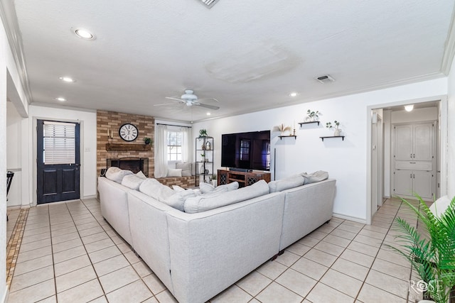 140 Van Zandt St, San Angelo, TX 76905 - living room featuring light tile patterned flooring, ceiling fan, a fireplace, ornamental molding, and recessed lighting