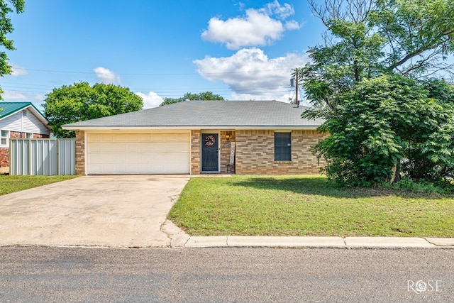 140 Van Zandt St, San Angelo, TX 76905 - view of front of home with brick siding, concrete driveway, and a garage