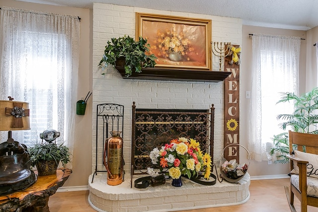 room details with hardwood / wood-style flooring and a brick fireplace