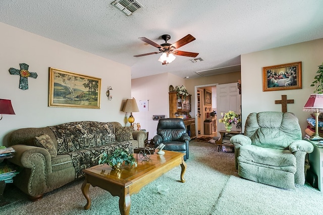 carpeted living room with ceiling fan and a textured ceiling