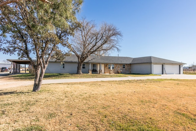 single story home with a garage and a front yard